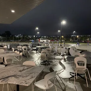 tables and chairs in a parking lot