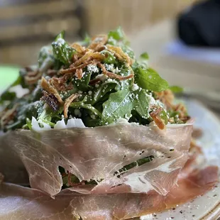ARUGULA &amp; PROSCIUTTO SALAD Arugula, Prosciutto, Goat Cheese, Crispy Shallots, White Balsamic Vinaigrette