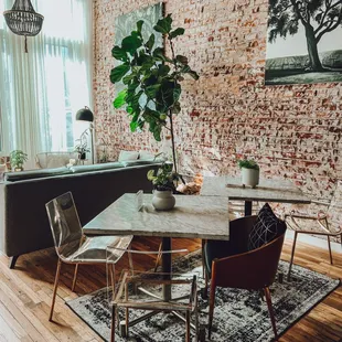 a brick wall and a dining table