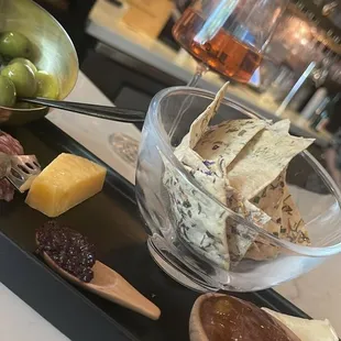 cheese, crackers, olives, and bread