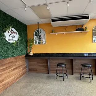 a bar with stools in front of it