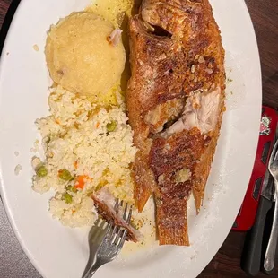 a plate of fish and rice