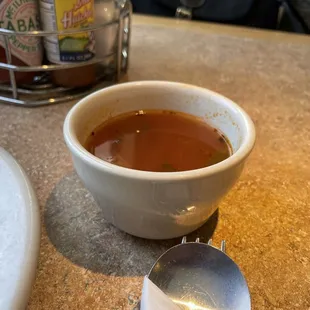 a bowl of soup and a spoon