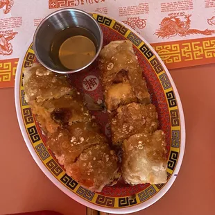a plate of food with dipping sauce