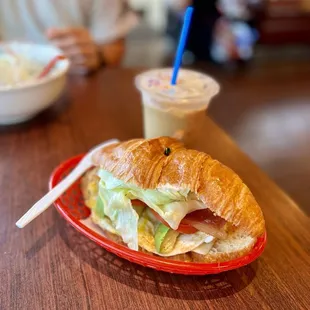 Bacon, egg, avocado, lettuce, tomato croissant sandwich. $6.50.