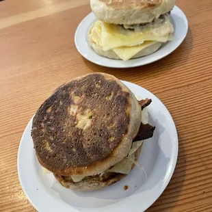 Breakfast sandwiches one in French toast the other plain English muffin.