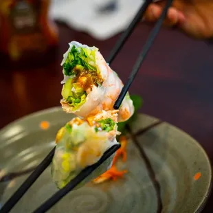 a plate of food with chopsticks