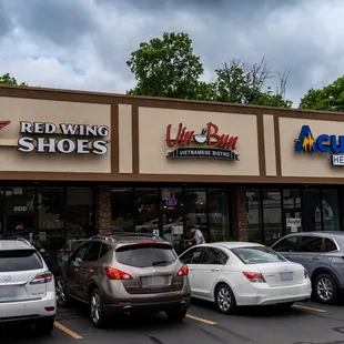 cars parked in front of a restaurant