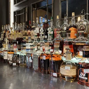 a long line of bottles of liquor