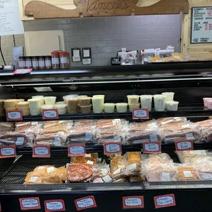 a display of cheeses and meats