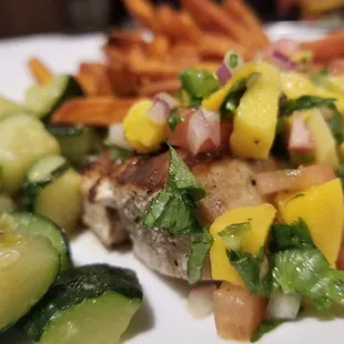 The mahi topped with mango, buttery zucchini,  sweet potato fries :)