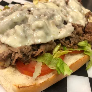 a sandwich with meat and cheese