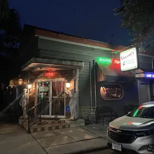 a car parked in front of the restaurant