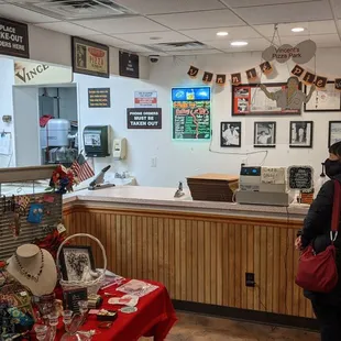 a woman standing in front of the counter