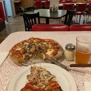 Small sausage and mushroom pizza.