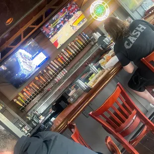 a man and a woman sitting at a bar