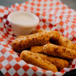 a basket of chicken sticks