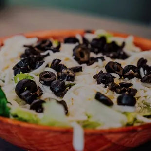 a pizza with black olives