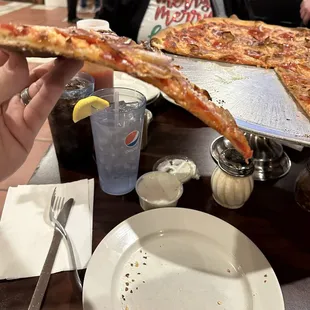 No flop, no crust bend, dry and overcooked slice. Did not order well-done.