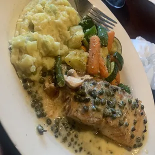 Salmon piccata with garlic mushrooms and vegetables. I would get this again.