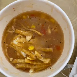 Chicken tortilla soup with cheese.