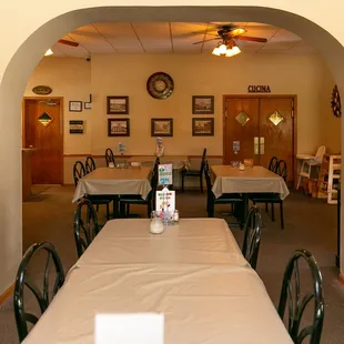 a dining room with tables and chairs