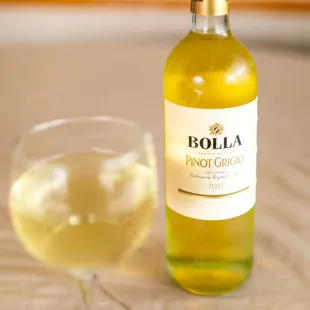 a bottle and a glass of wine