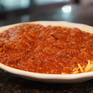 a bowl of spaghetti and sauce