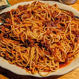 Full spaghetti plate with meat sauce.