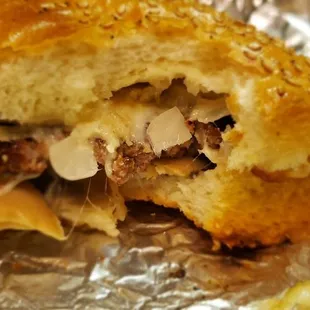 The cheesesteak on garlic bread with mushrooms and onions.