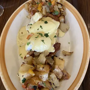 Eggs Benedict - Huge portion of breakfast potatoes and the cheese sauce, YUM!