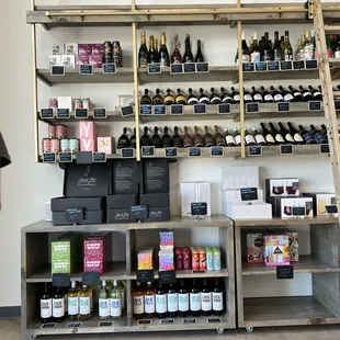 a man standing in front of a wine shop