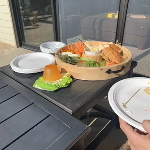 Veggie platter with hummus and vegetarian bun me sandwiches.