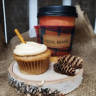 a cup of coffee and a cupcake