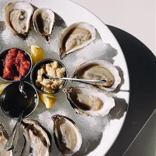 a platter of oysters on ice