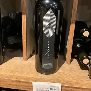 a bottle of wine on a shelf
