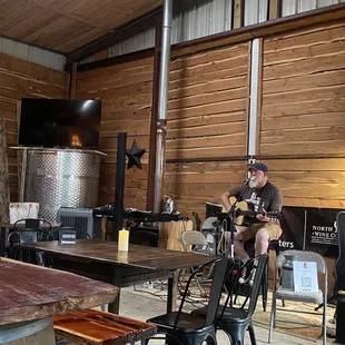 a group of people in a wine cellar