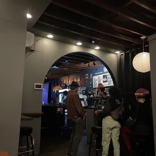 a group of people sitting at a bar