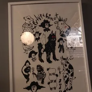 a black and white drawing of a group of cats