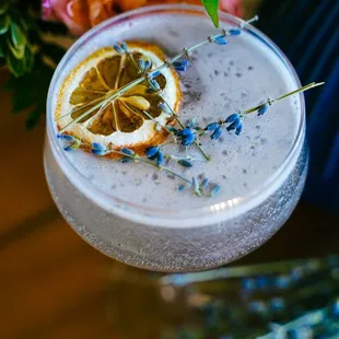 a drink with a lemon slice on the rim