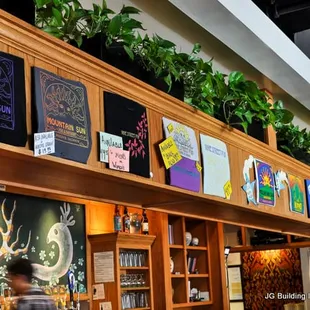 a bar with plants on the wall