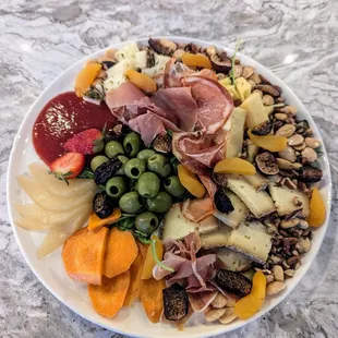 Cheese and Meat place with housemade jam and poached pears.