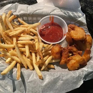 Shrimp basket with 8 shrimp that are mostly breading.