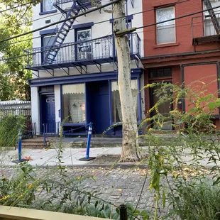 View from front summer patio looking onto a cobblestone street