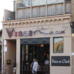 people walking in front of a restaurant