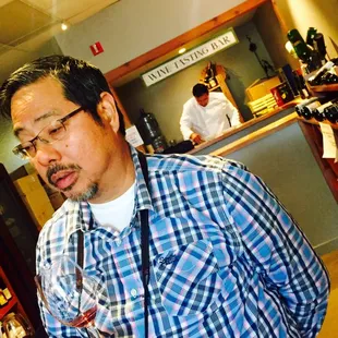 The fabulous owner Alex discussing wines, &amp; talented chef Carlos in the back preparing Peruvian pairings :)