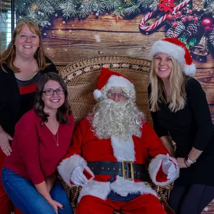 Miss Jacki, Miss Jenny and Miss Julie with Santa at the Annual Holiday Tea.