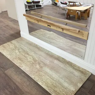 Infant room balance bar for the new skill of standing and walking independently.