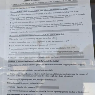 COVID protocol signs posted outside the window