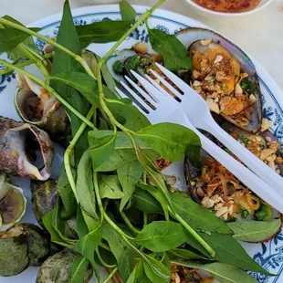 Snails and mussels with dipping sauces